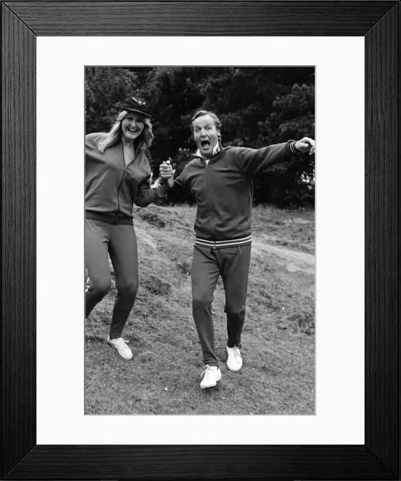 Framed Print : Television personality Nicholas Parsons jogging with his daughter. September 1976