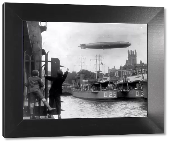 German airship Graf Zeppelin flies over Bristol docks and the destroyer HMS Warwick (D25