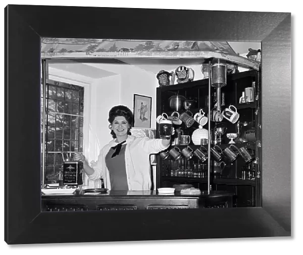 Pat Phoenix at home in her bar. 16th April 1968