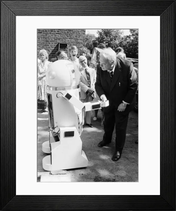 Framed Print : TV Astrologer Patrick Moore meets Denby the robot, which talks, shakes hands and more Framed Print : TV Astrologer Patrick Moore meets Denby the robot, which talks, shakes hands and more