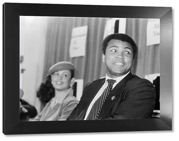 Muhammad Ali in London for exhibition fights, pictured with Veronica Porche at a press