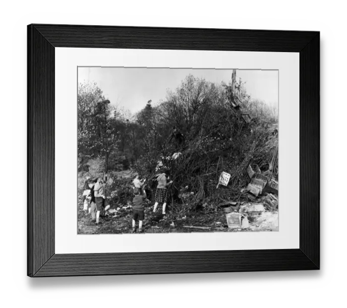 Framed Print : Busy building their massive bonfire in readiness for tonight are some of the children in