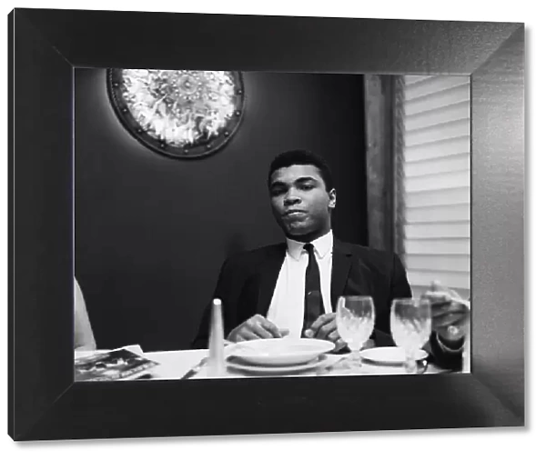 Cassius Clay (Pictured) having lunch in London before his trip to Scotland for an