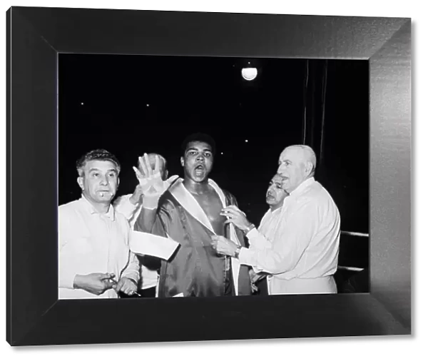 Cassius Clay aka (Muhammad Ali) vs Henry Cooper in their first fight at Wembley Stadium