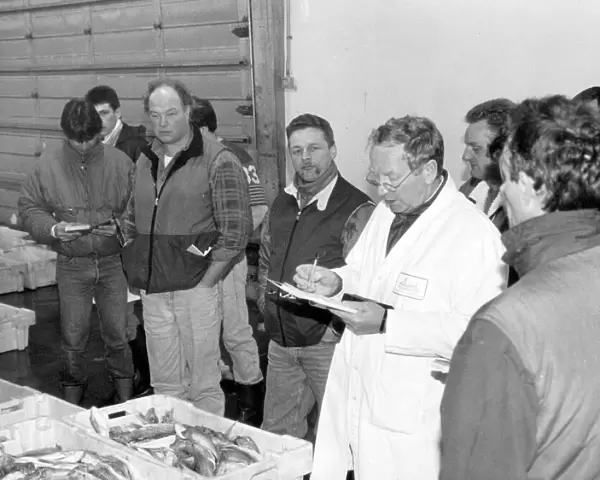 Auctioneer Arthur THomas conducting business at Brixham fishmarket in the 1980s