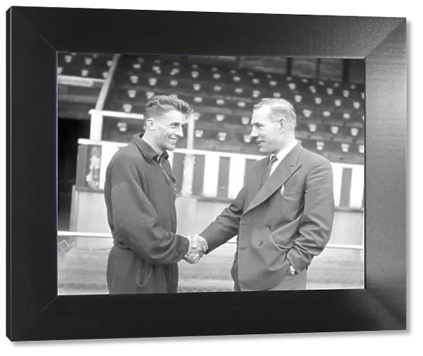Torquay United manager Eric Webber (right) bidding farewell to Peter Wakeham on hs