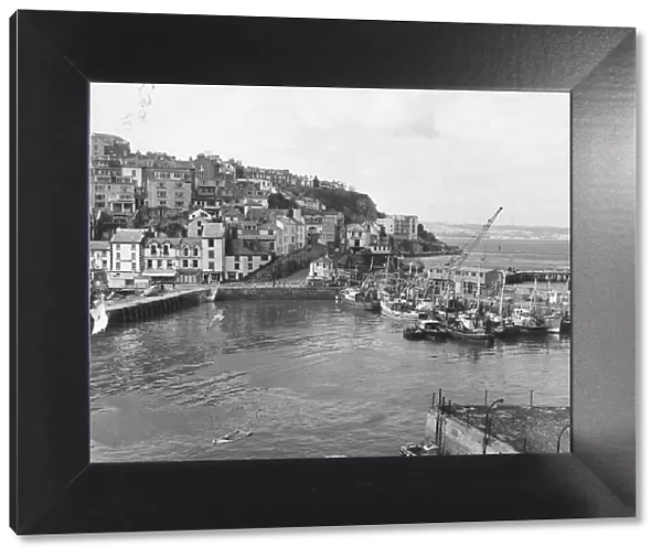 Its March 1970 and work has begun extending the harbour at Brixham to provide
