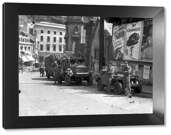 Military vehicles in Abbey Road, Torquay in July 1949. Adverising signs - Ovaltine