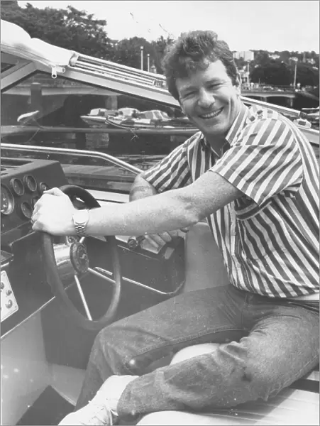 Jim Davidson at the wheel of his Princess boat on Torquay Marina20th July1987