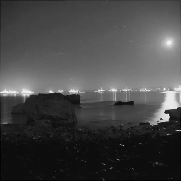 Royal Navy fleet anchored in Torbay and floodlit in July 1969