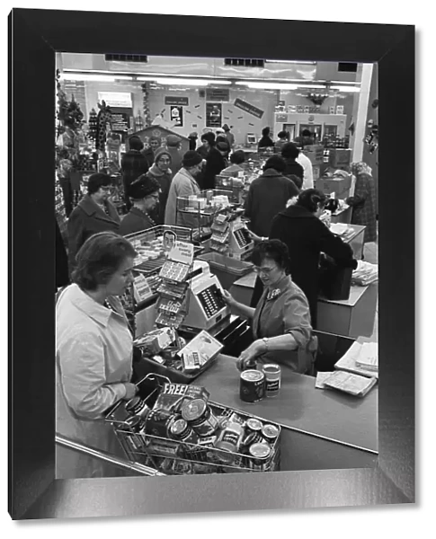 Customers at the checkout counter of the Nottingham Co-Op supermarket. 1st May 1963