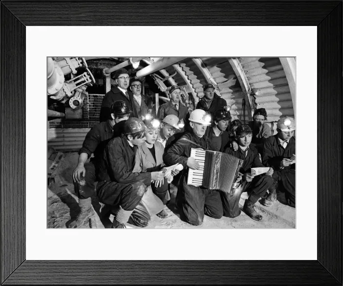 Framed Print : Carol service by miners 600 ft down. An accordion play and miners voices are raised in