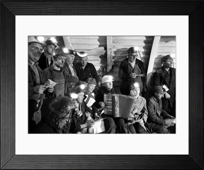 Framed Print : Carol service by miners 600 ft down. An accordion play and miners voices are raised in Framed Print : Carol service by miners 600 ft down. An accordion play and miners voices are raised in