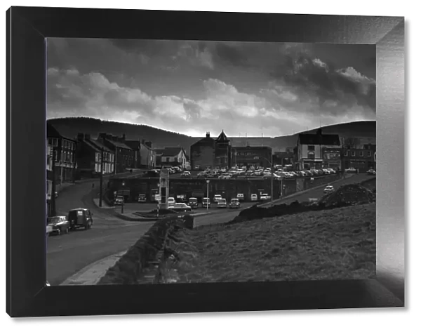 Caerphilly town centre seen from the Castle grounds. In the background the brooding mass