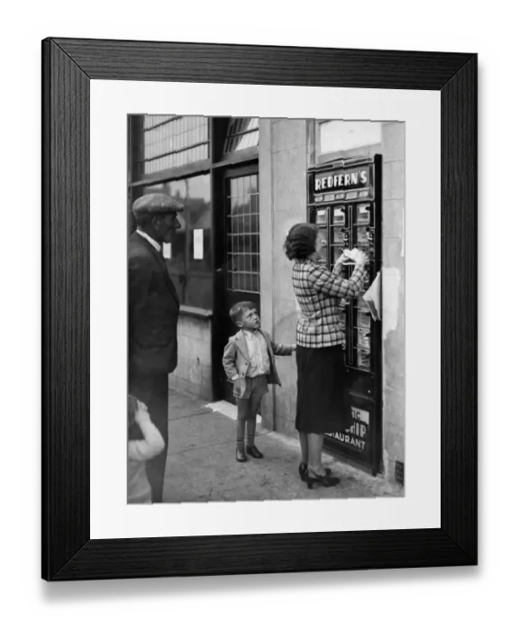 Framed Print : A woman seen here using the Automatic Fish and Chip dispenser at Redfern