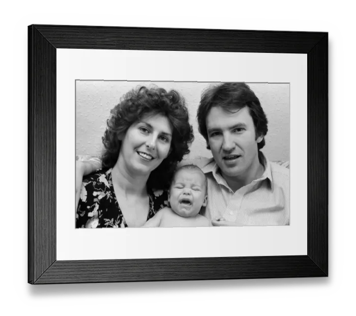 Framed Print : Actor Larry Lamb with his wife Linda and three month old son George. 15th March 1980