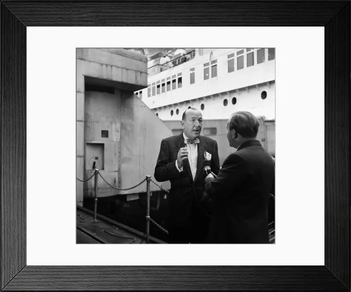 Framed Print : Noel Coward arrives at Southampton onboard the Queen Elizabeth. 4th June 1957 Framed Print : Noel Coward arrives at Southampton onboard the Queen Elizabeth. 4th June 1957