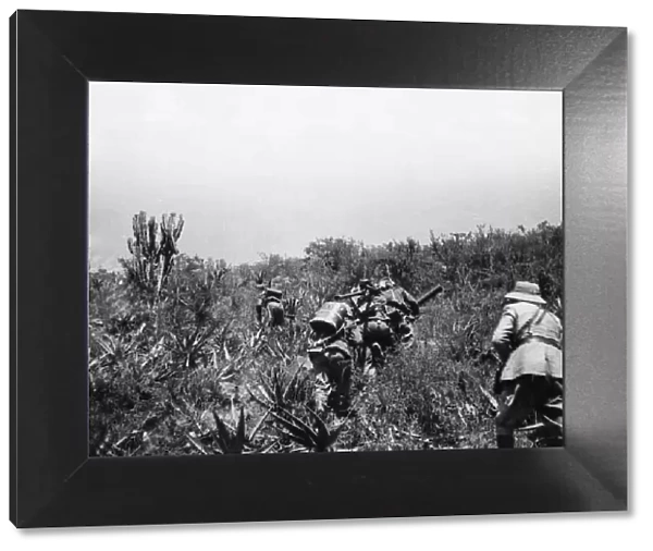 Abyssinian War October 1935 Italian infantry with machine guns follow in the wake