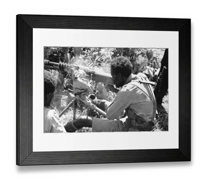 Framed Print : Abyssinian War September 1935 Abyssinian machine gunner firing an old Hotchkiss