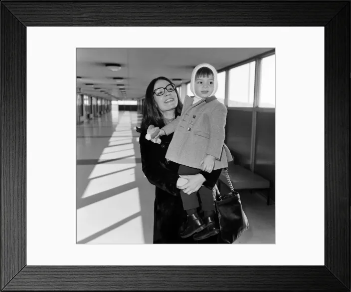 Framed Print : Nana Mouskouri arrives at Heathrow Airport from paris, with her son Nicky, aged 2 Framed Print : Nana Mouskouri arrives at Heathrow Airport from paris, with her son Nicky, aged 2