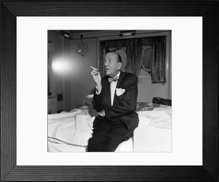 Framed Print : Noel Coward arrives at Southampton onboard the Queen Elizabeth. 4th June 1957 Framed Print : Noel Coward arrives at Southampton onboard the Queen Elizabeth. 4th June 1957