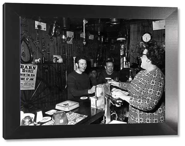 Publican of the year Mrs Jean Cook pulling a pint. 6th May 1973
