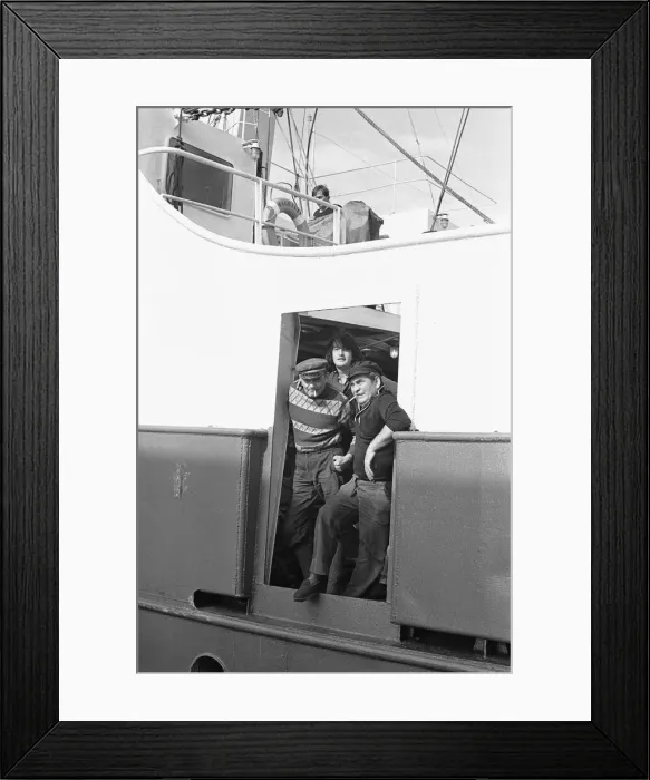 Framed Print : Crewman of the trawler Magritte seen here having a cigarette whilst tied up at St Andrews
