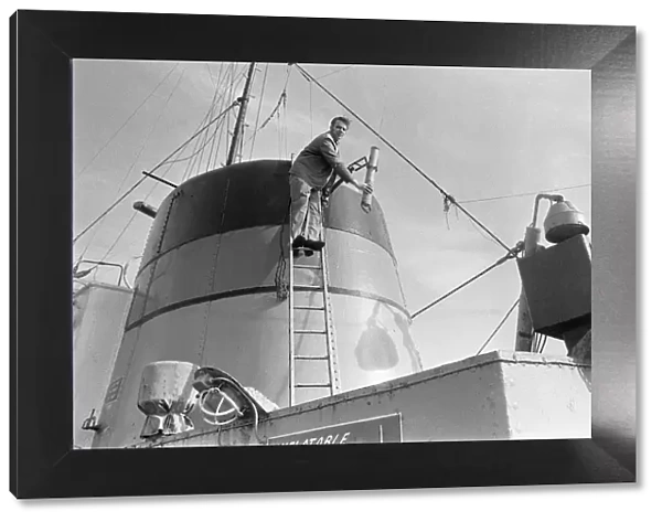 Crewman on the St Gerontius seen here repairing the ships radio antenna. 11th March 1978