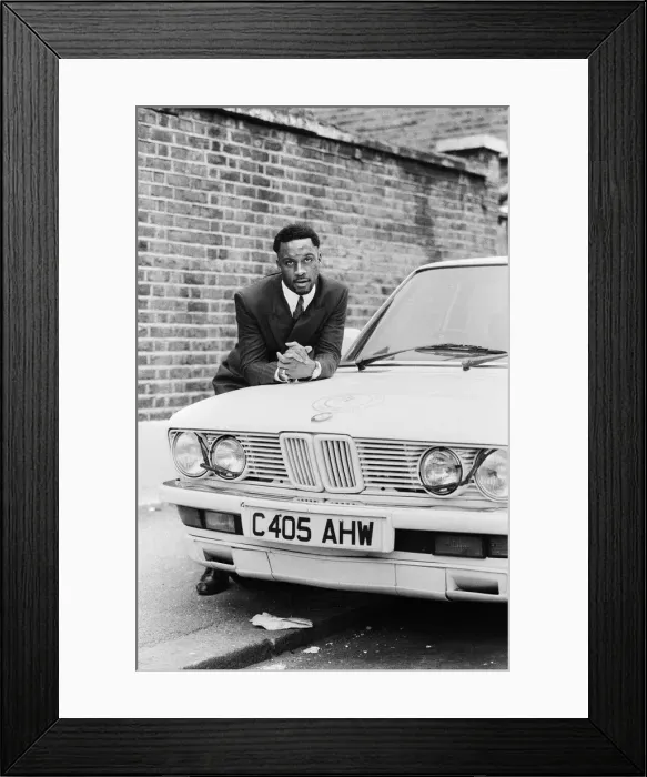 Framed Print : Middleweight boxer Nigel Benn posing with his 3 series BMW. Circa 1987 Framed Print : Middleweight boxer Nigel Benn posing with his 3 series BMW. Circa 1987