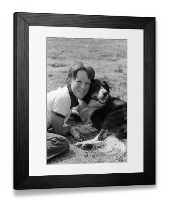 Framed Print : 9 year old Simon Mallon who lives in Shaldon, Devon, was given a puppy for his birthday