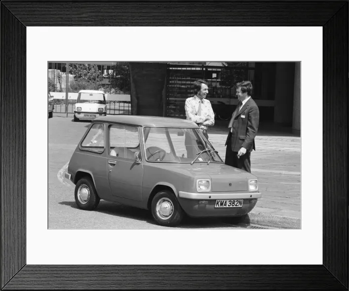 Framed Print : The Electric Car. A new unusually quiet little motor car can be seen going