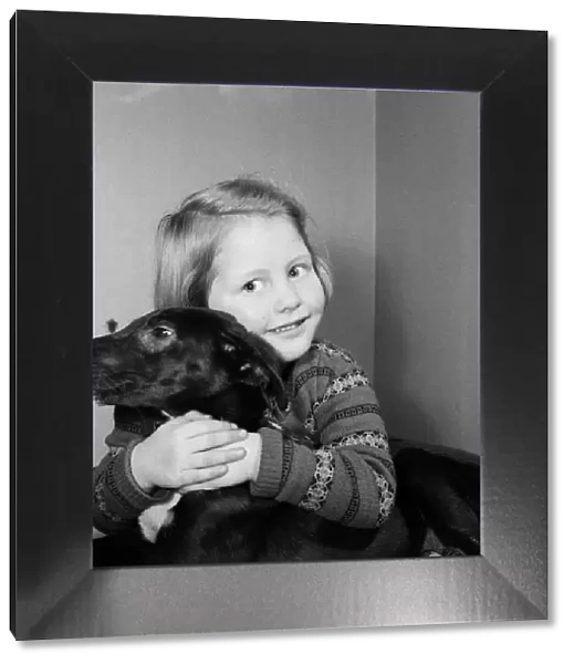 Helen Windle, aged 5, of Doncaster, with Janey, the puppy she helped save from a dogs