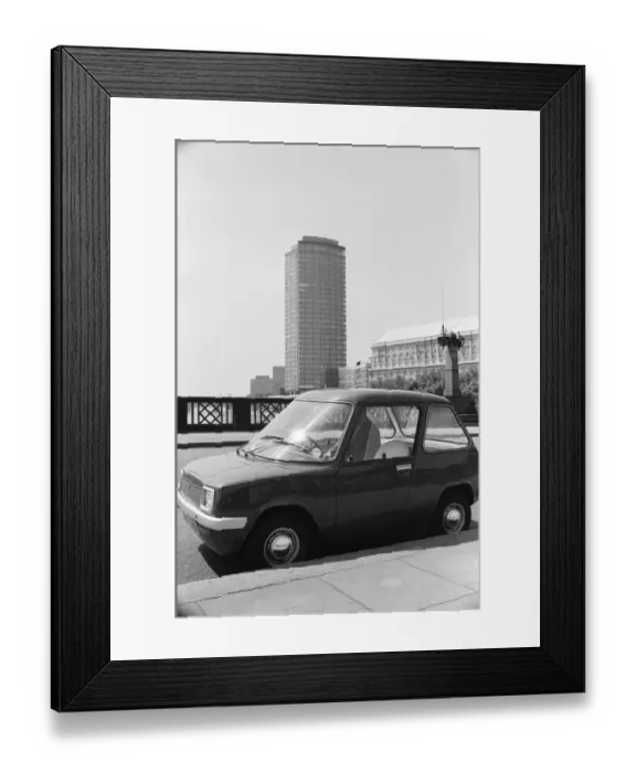 Framed Print : The Electric Car. A new unusually quiet little motor car can be seen going