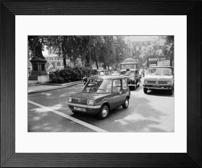 Framed Print : The Electric Car. A new unusually quiet little motor car can be seen going Framed Print : The Electric Car. A new unusually quiet little motor car can be seen going