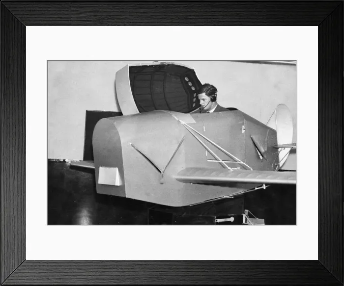 Framed Print : A pupil emerging from the Link trainer used for initial instruction at an RAF training Framed Print : A pupil emerging from the Link trainer used for initial instruction at an RAF training