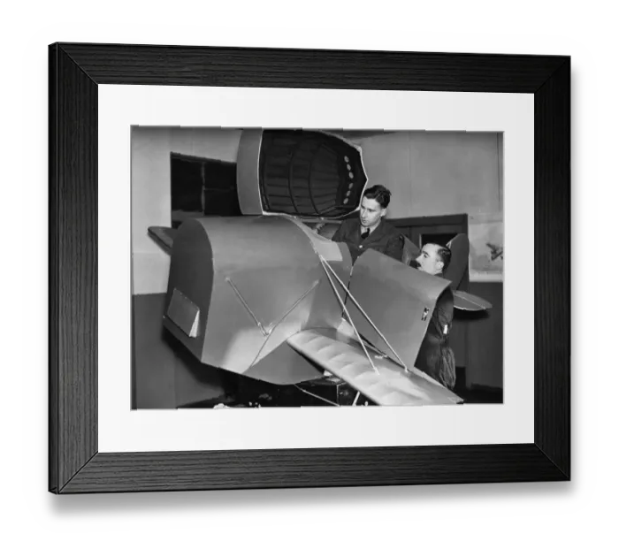 Framed Print : A pupil emerging from the Link trainer used for initial instruction at an RAF training Framed Print : A pupil emerging from the Link trainer used for initial instruction at an RAF training