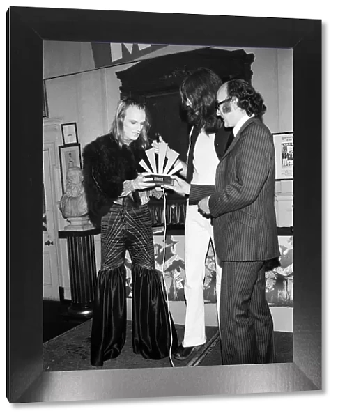 Brian Eno holding receiving his award at The Oval Pop Festival, Oval Cricket Ground