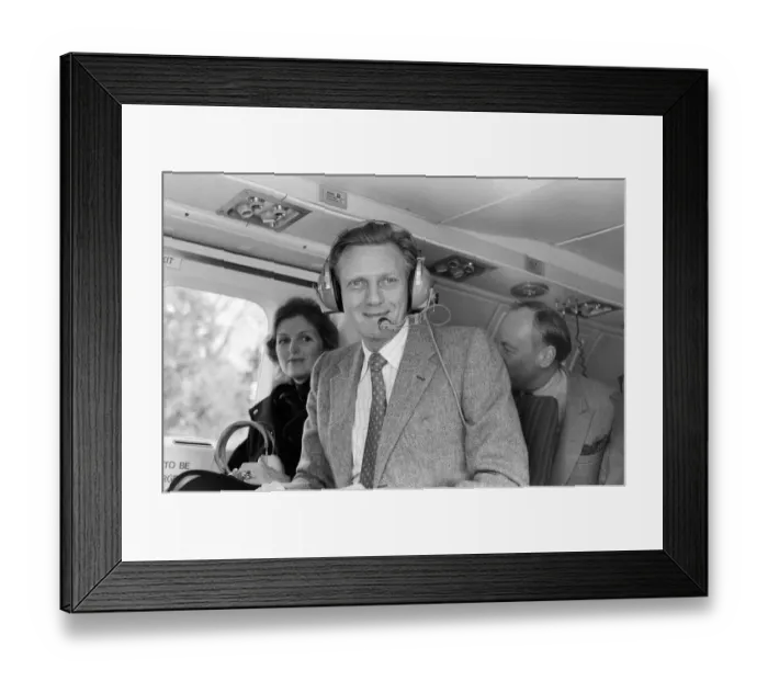 Framed Print : Michael Heseltine in a helicopter. He is pictured a few days following his resignation as