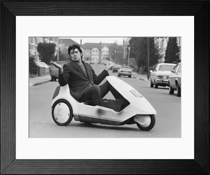 Framed Print : 15 stone Roy Stuart of Ilford, Essex, owner of a C5, can only get six miles out of his Framed Print : 15 stone Roy Stuart of Ilford, Essex, owner of a C5, can only get six miles out of his
