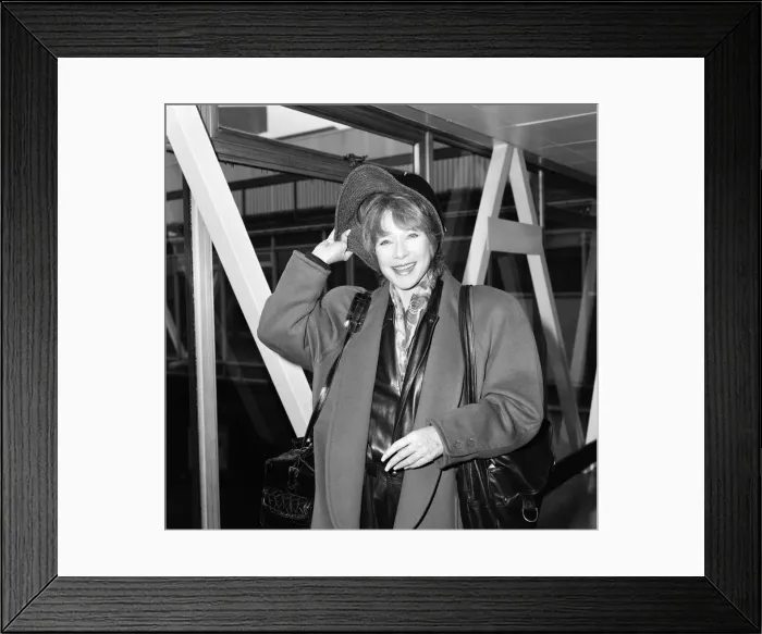 Framed Print : Shirley MacLaine leaving Heathrow Airport. 29th October 1985