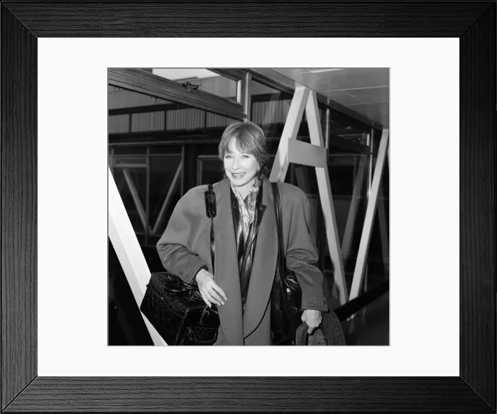 Framed Print : Shirley MacLaine leaving Heathrow Airport. 29th October 1985