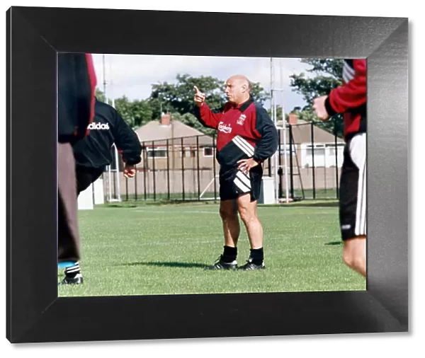 Liverpool coach Ronnie Moran gives instructions during a training session