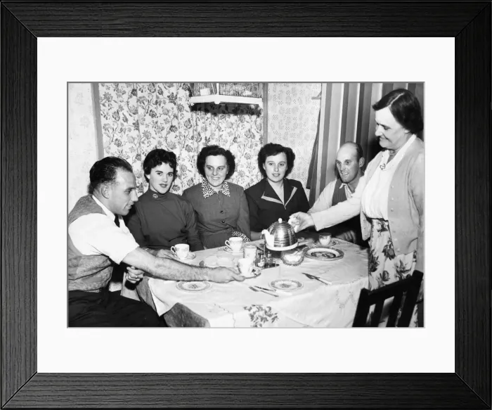 Framed Print : Liverpool full back Ronnie Moran has a cup of tea poured for him bis mother at home Framed Print : Liverpool full back Ronnie Moran has a cup of tea poured for him bis mother at home