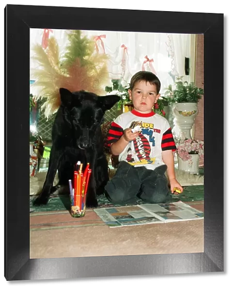 Blackie the dog is pictured with a small boy. 17th June 1993