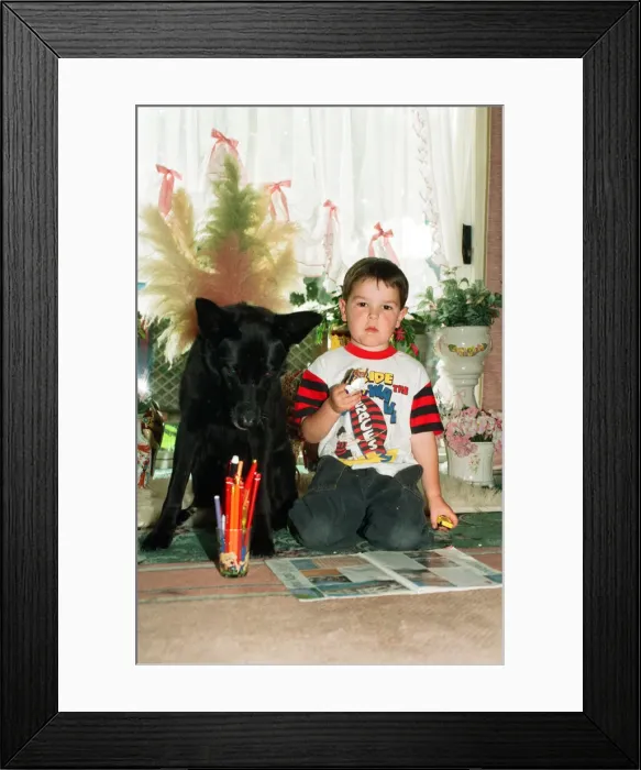 Framed Print : Blackie the dog is pictured with a small boy. 17th June 1993 Framed Print : Blackie the dog is pictured with a small boy. 17th June 1993