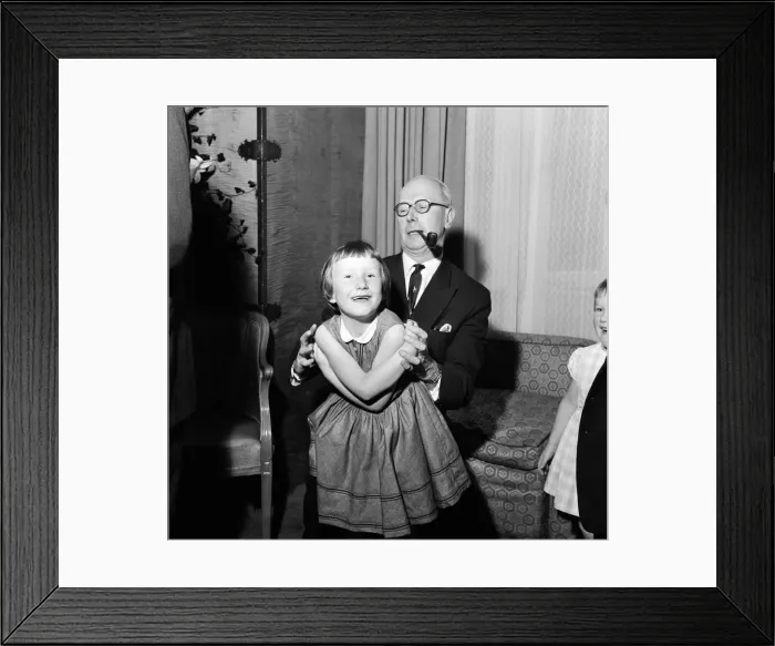 Framed Print : Sir John Wolfenden playing with 6 year old Belinda Agard at The Savoy