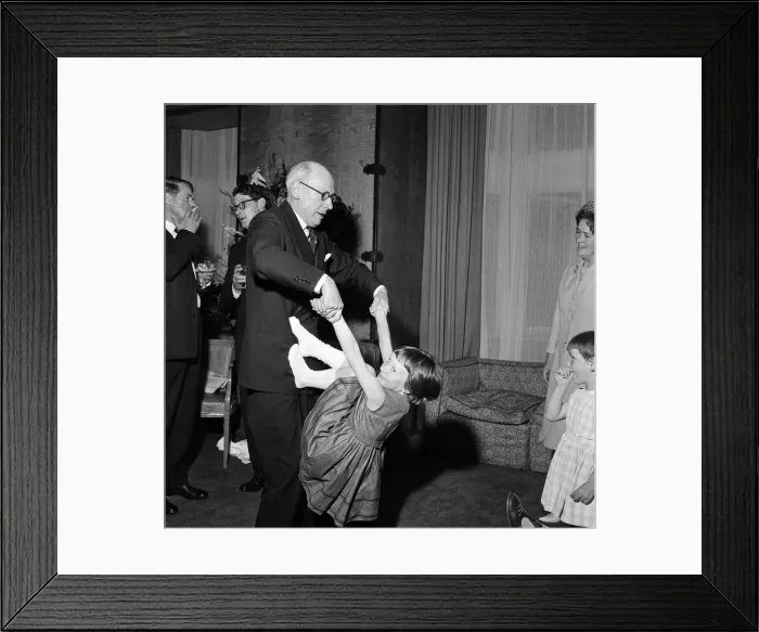 Framed Print : Sir John Wolfenden playing with 6 year old Belinda Agard at The Savoy Framed Print : Sir John Wolfenden playing with 6 year old Belinda Agard at The Savoy