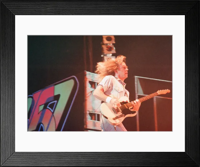 Framed Print : Status Quo in concert at the NEC in Birmingham, 11th December 1990. Our Picture Shows Framed Print : Status Quo in concert at the NEC in Birmingham, 11th December 1990. Our Picture Shows