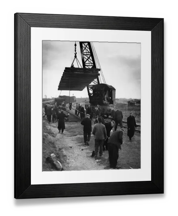 Framed Print : Construction crew seen here working against the clock to complete the laying of a new
