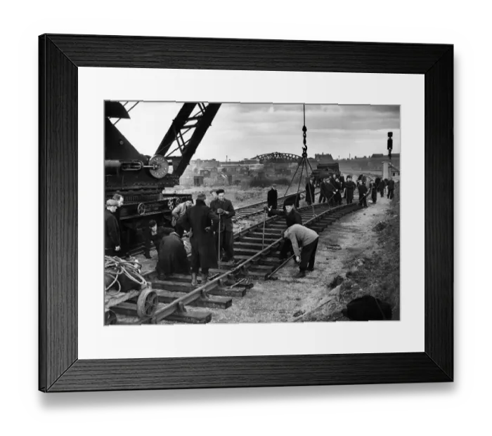 Framed Print : Construction crew seen here working against the clock to complete the laying of a new